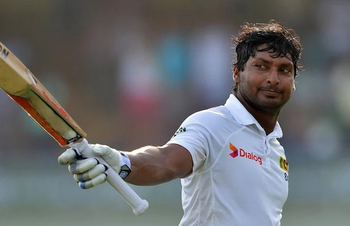 Kumar Sangakkara raises his bat to celebrate a magnificent innings