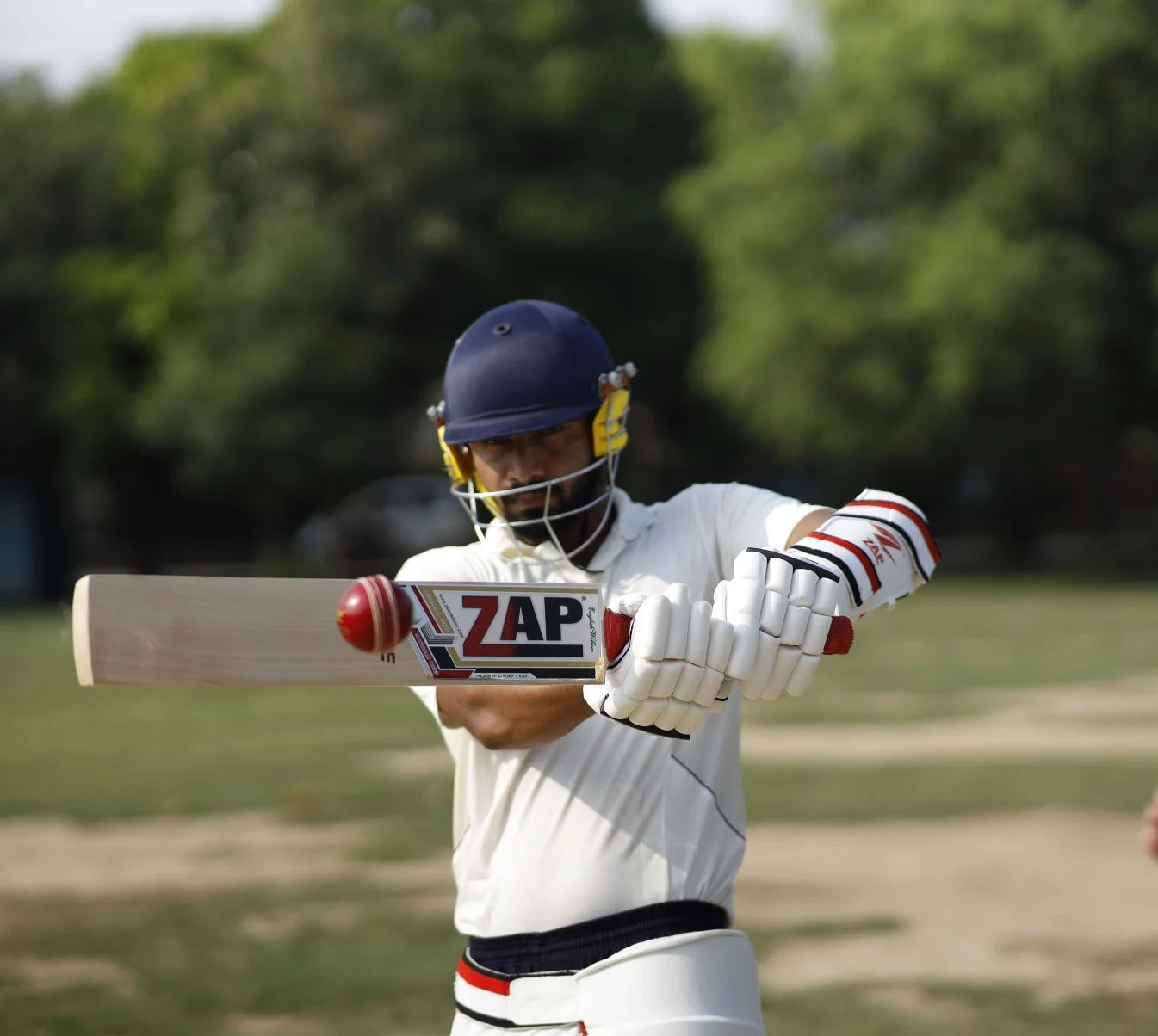 A ZAP Athlete plays the pull shot in cricket, wearing the ZAP Cricket Kit