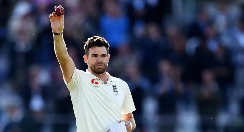 James Anderson raises a cricket ball to celebrate a fifer