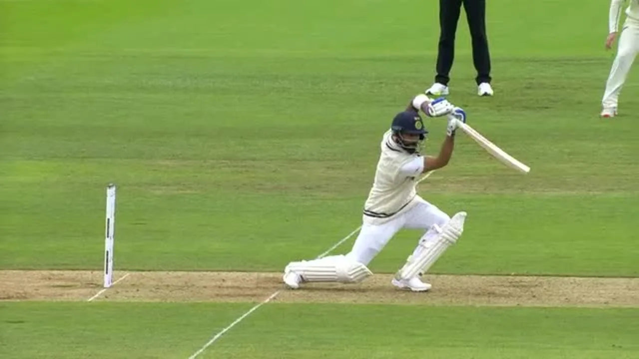 Virat Kohli effortlessly drives the ball through the cover playing a picturesque cover drive