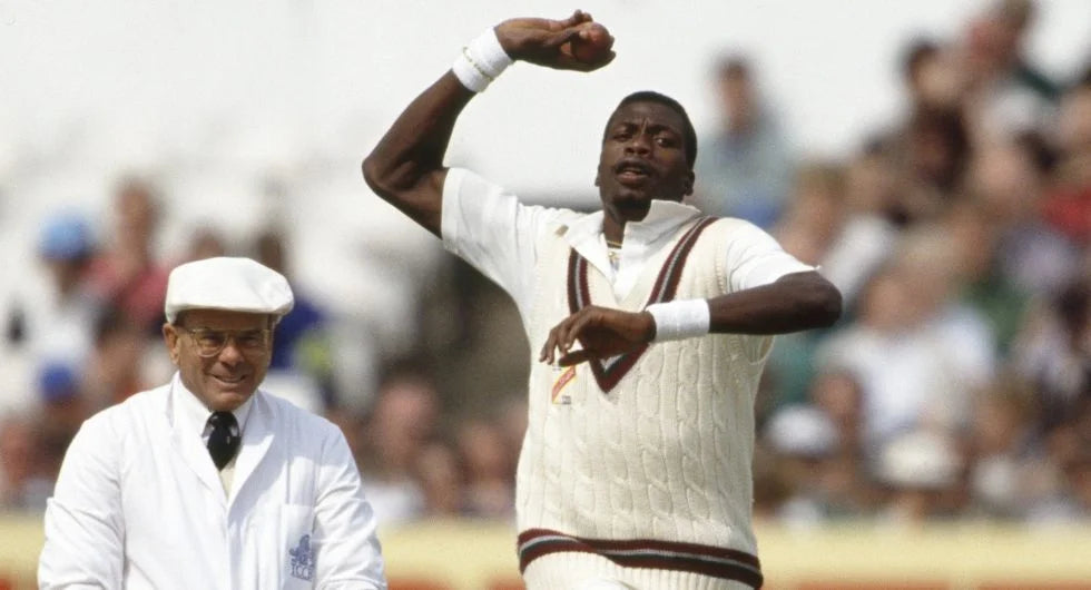 Sir Curtly Ambrose bowling with his high arm bowling action in a test match against England