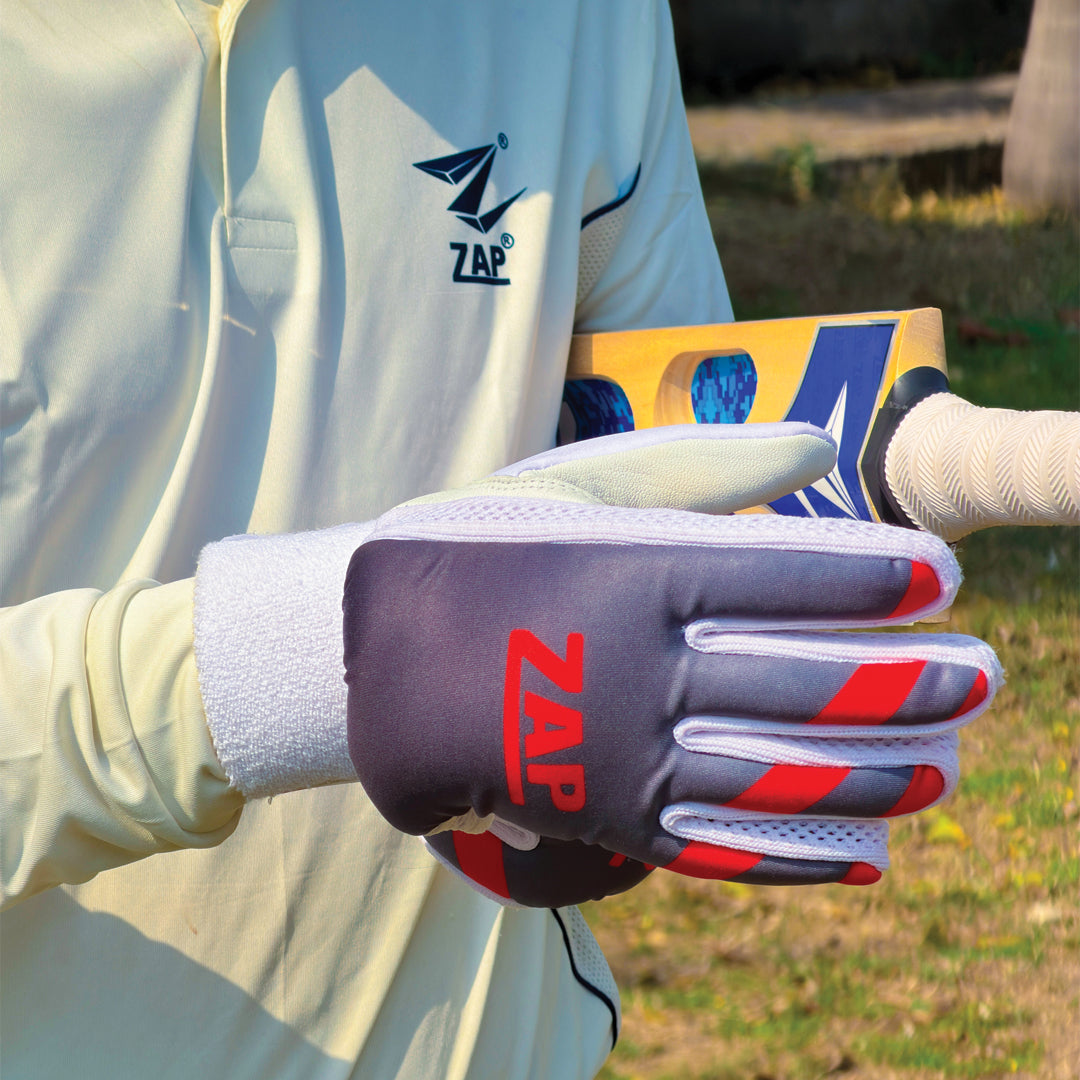 A pair of specialized tennis ball cricket batting gloves featuring lightweight padding and a textured palm for enhanced grip