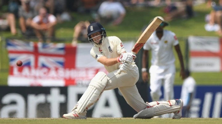 Joe Root plays the sweep shot in a test cricket match
