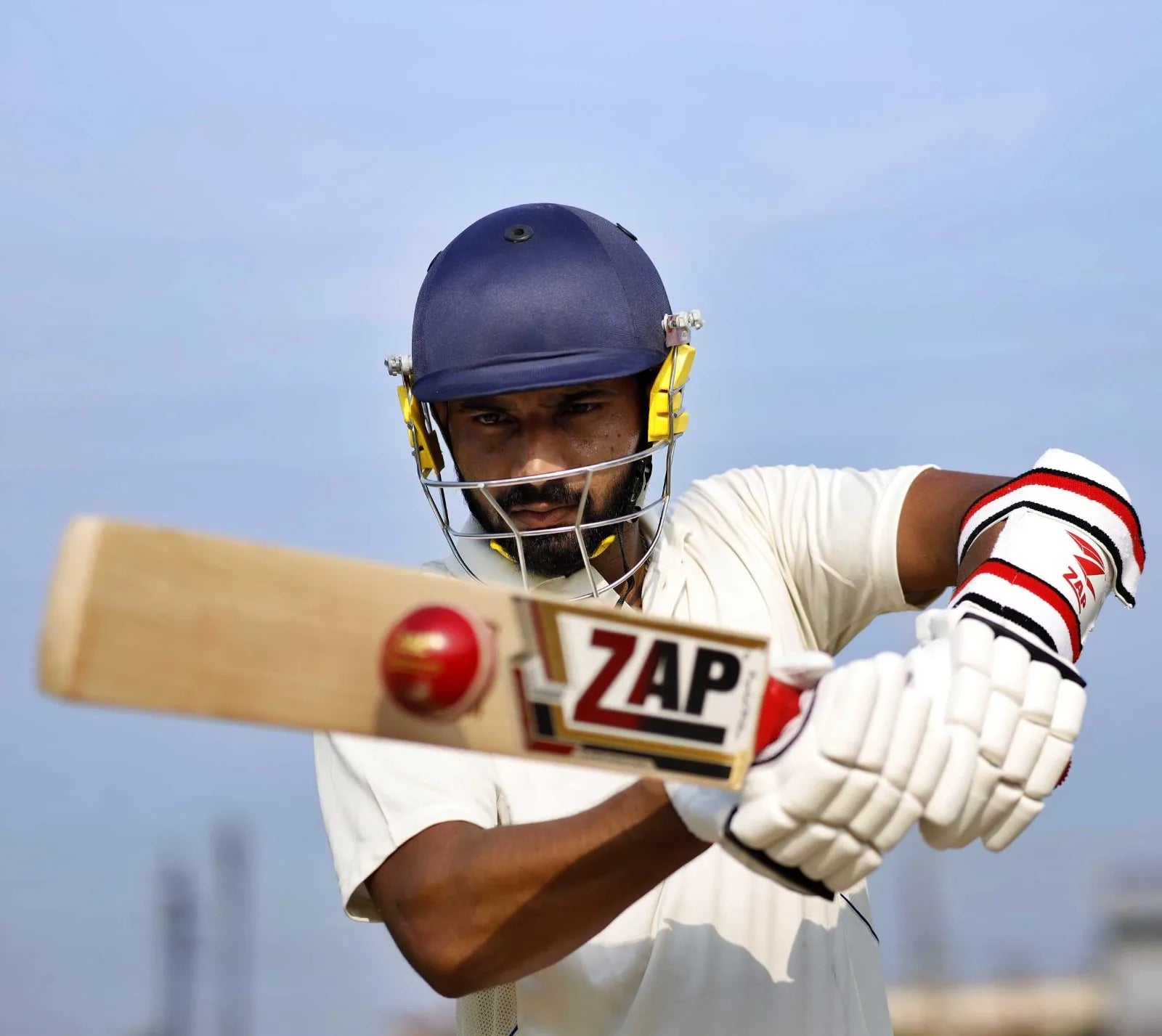 A ZAP Athlete plays a pull shot with the ZAP Cricket Bat in hand