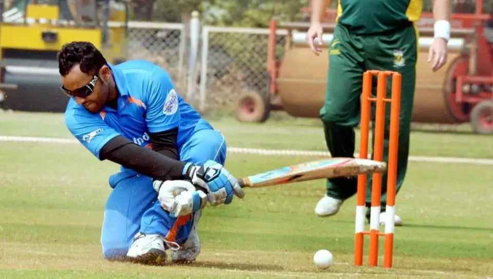 A blind cricket player batting
