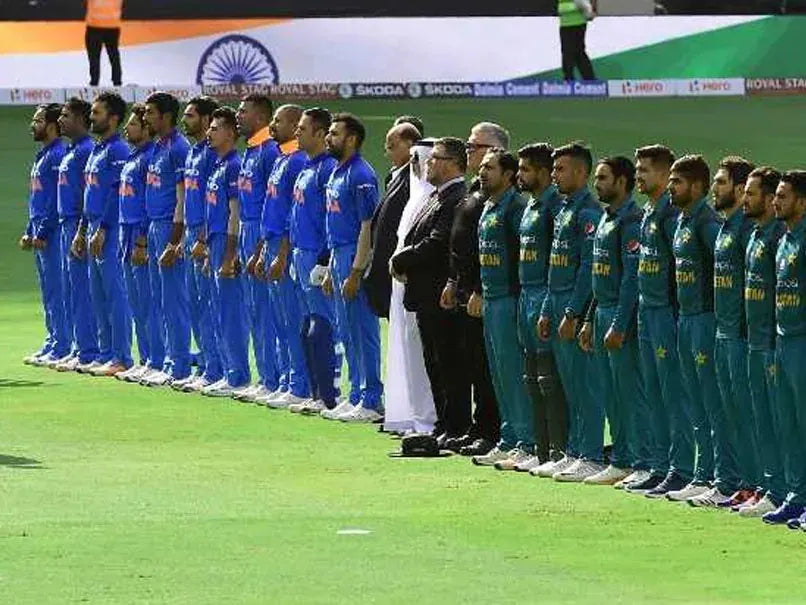 The Indian National Cricket Team and the Pakistan National Cricket Team stand for the national anthems before the match