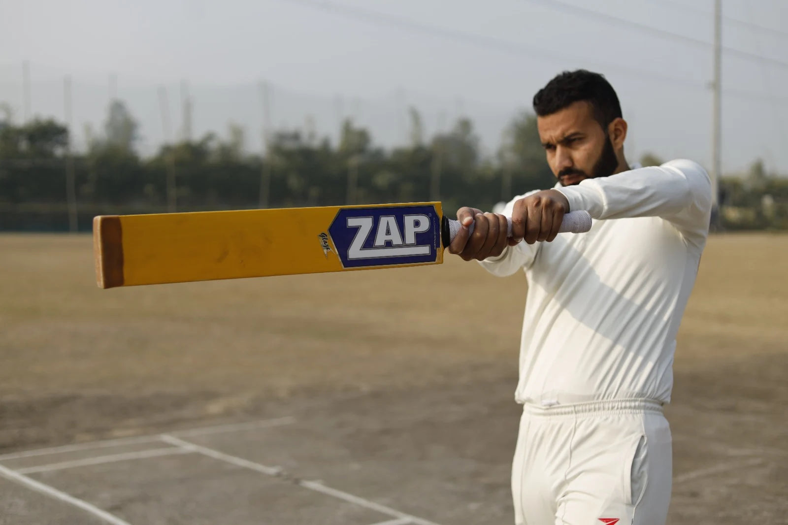 A player doing his shadow batting practoce with the ZAP Glaze Tennis Cricket Bat