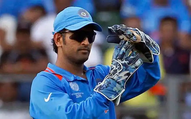 MS Dhoni takes a GRS review in a cricket match as captain